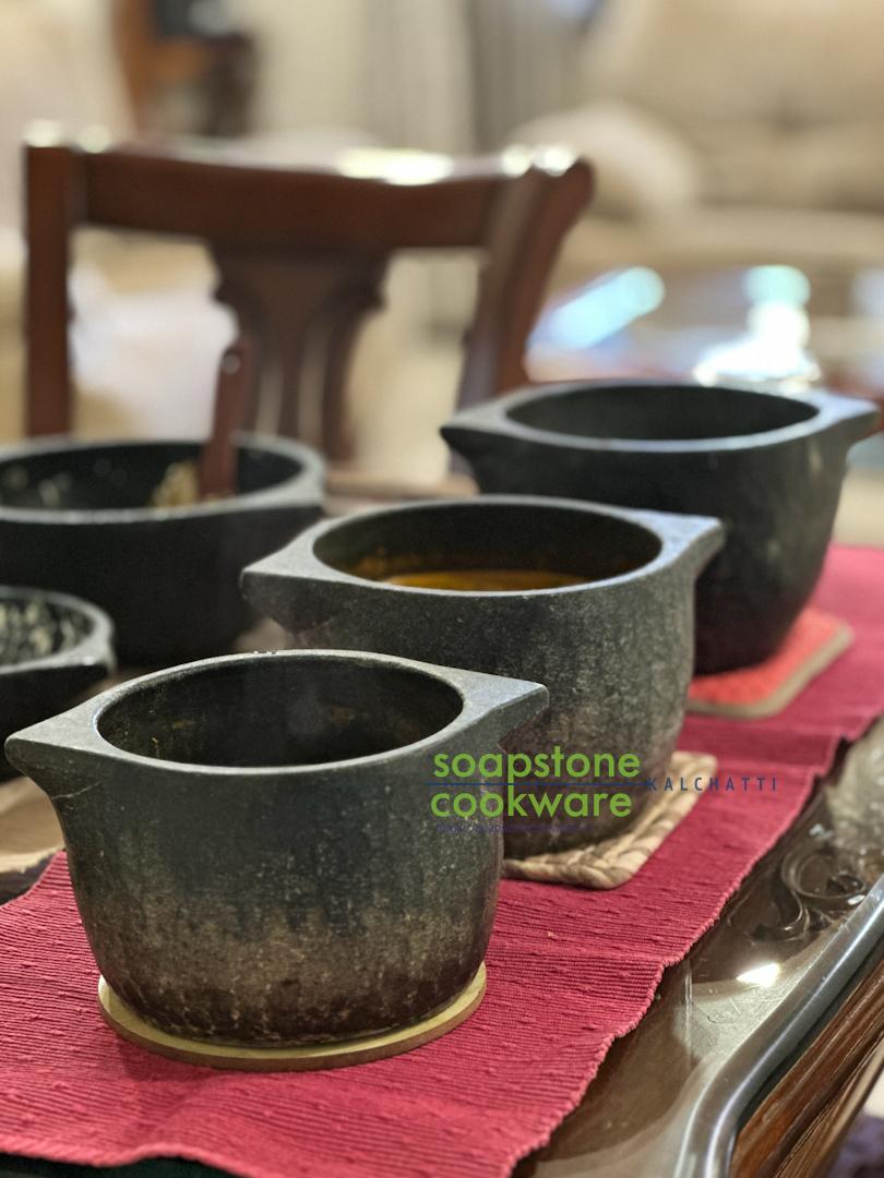 Soapstone Cookware vessels with the Soapstone Cookware logo